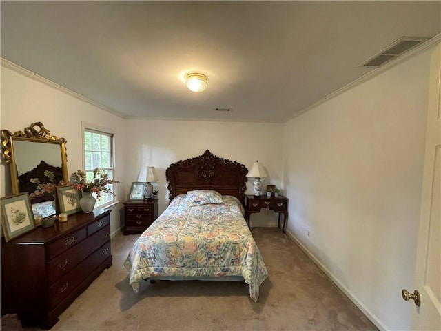 bedroom featuring ornamental molding and carpet floors