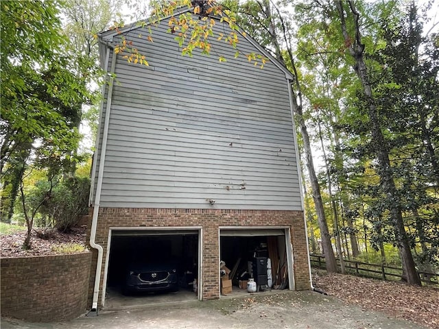 view of side of property with a garage