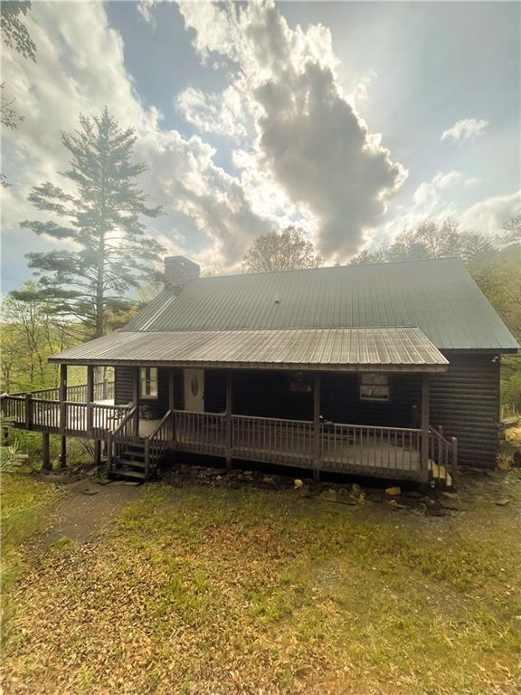 8072 Doublehead Gap Rd, Blue Ridge, GA 30513 - back of property with a deck and a chimney
