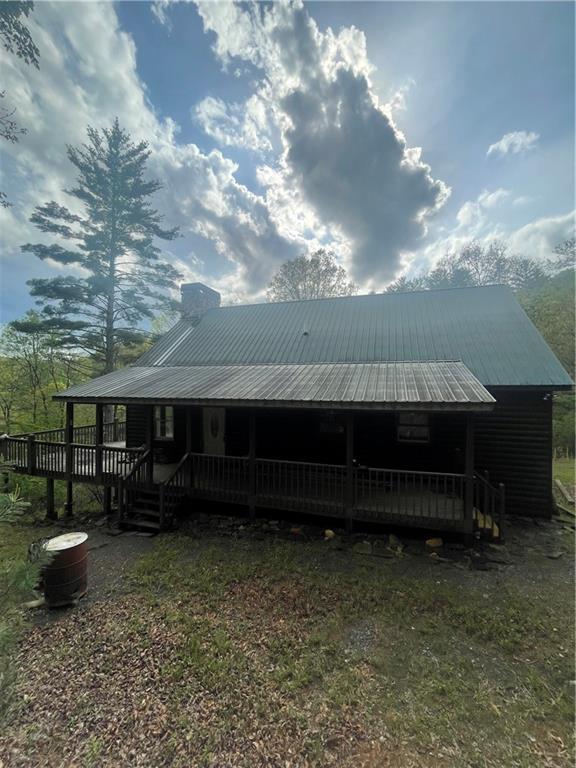 8072 Doublehead Gap Rd, Blue Ridge, GA 30513 - back of property featuring metal roof, a chimney, and a porch