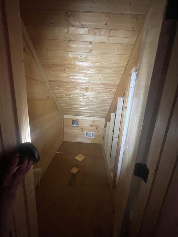 8072 Doublehead Gap Rd, Blue Ridge, GA 30513 - additional living space with wood walls, visible vents, and wooden ceiling