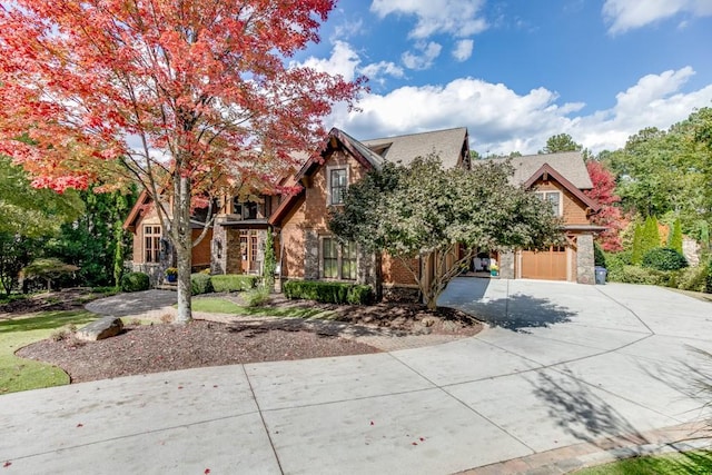 tudor-style house featuring a garage