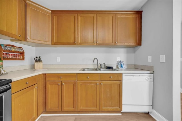 276 Arbor Gate Dr, Cornelia, GA 30531 - kitchen with white dishwasher, light countertops, brown cabinetry, and stove