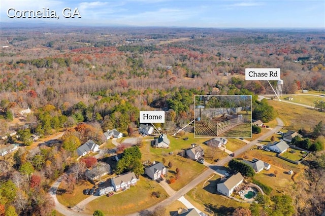 276 Arbor Gate Dr, Cornelia, GA 30531 - aerial overview of property's location with a heavily wooded area
