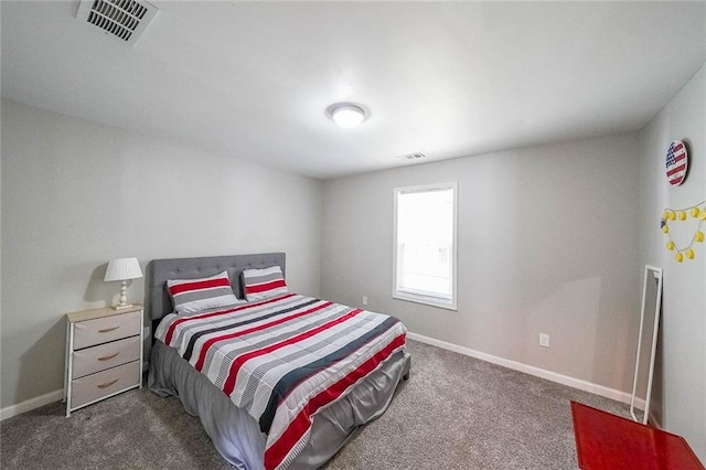 bedroom with visible vents, baseboards, and dark colored carpet
