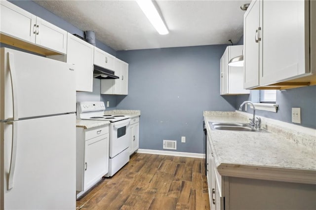 kitchen featuring dark wood-type flooring, white appliances, sink, and white cabinets