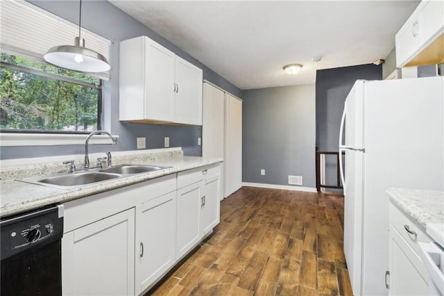 kitchen with decorative light fixtures, black dishwasher, white fridge, and white cabinets