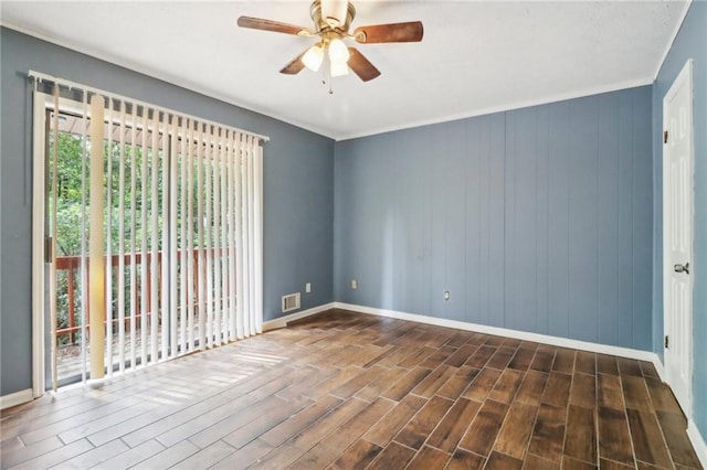 unfurnished room featuring ceiling fan and dark hardwood / wood-style flooring