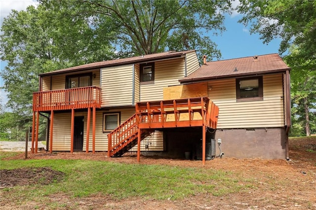 rear view of house featuring a deck