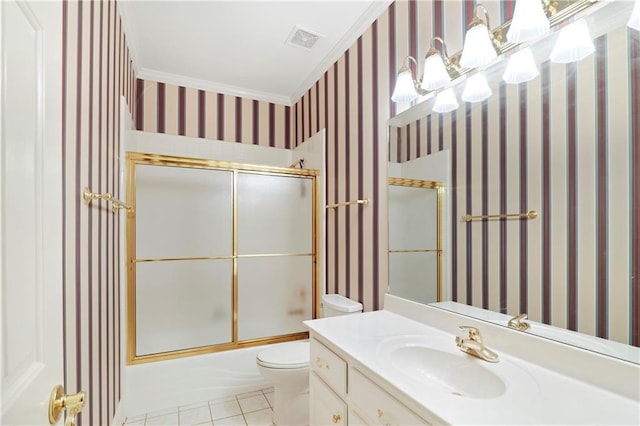 full bathroom featuring toilet, crown molding, tile floors, oversized vanity, and bath / shower combo with glass door