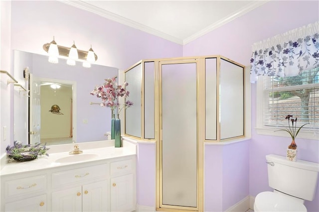 bathroom featuring toilet, an enclosed shower, vanity, and crown molding