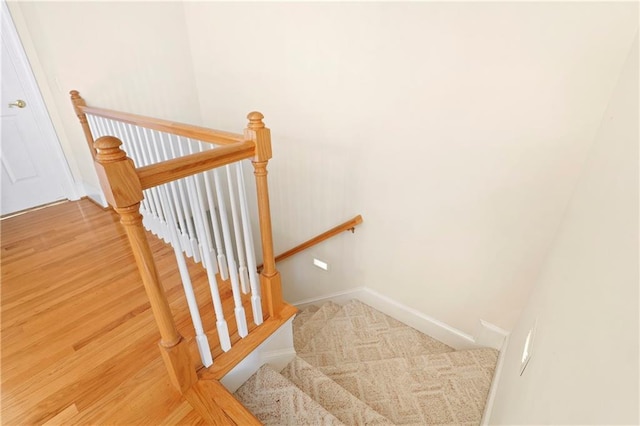 stairway featuring light hardwood / wood-style flooring