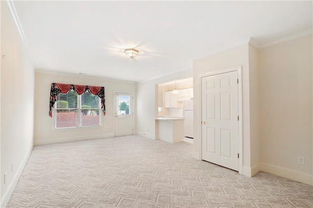 unfurnished room with light carpet and crown molding