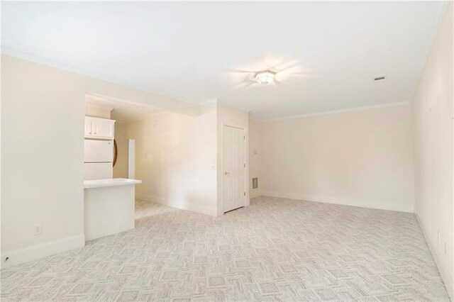 empty room featuring light colored carpet