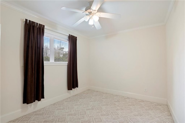 spare room featuring ceiling fan and ornamental molding