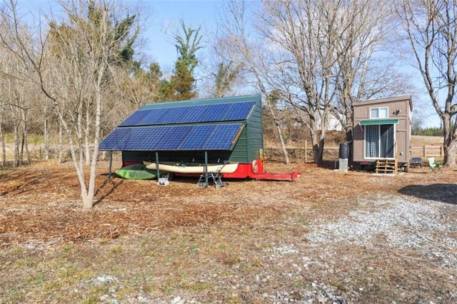 view of outdoor structure with solar panels