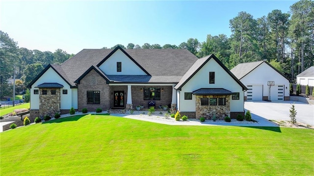 view of front of house with a garage and a front yard