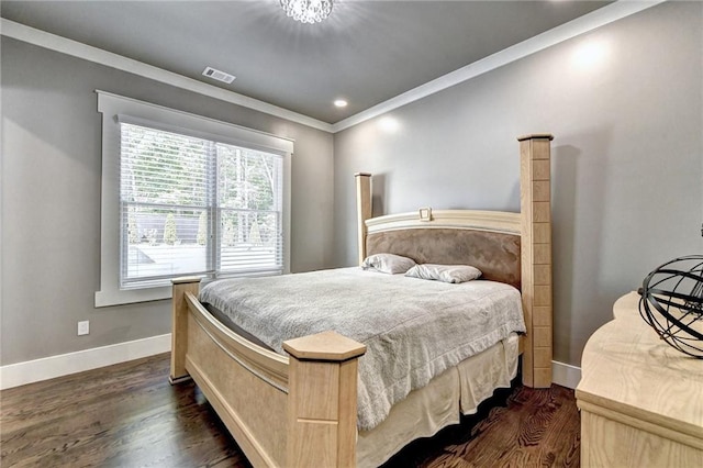 bedroom featuring crown molding and dark hardwood / wood-style floors