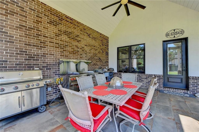 view of patio featuring area for grilling and ceiling fan