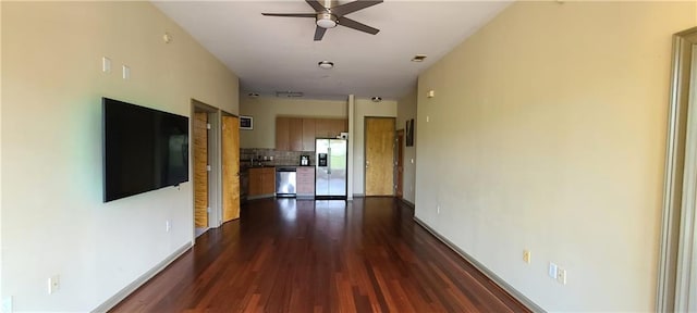 hallway with dark wood-style flooring and baseboards