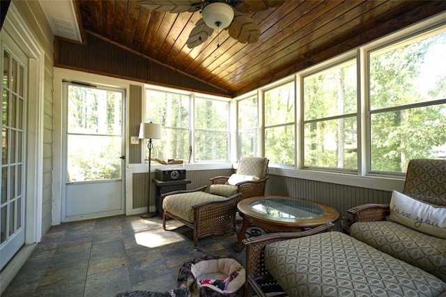 sunroom / solarium with lofted ceiling, ceiling fan, and wooden ceiling