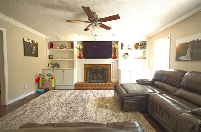 living room with ceiling fan, ornamental molding, a textured ceiling, and a wealth of natural light