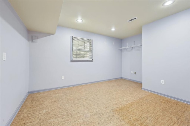 carpeted empty room with recessed lighting, visible vents, and baseboards