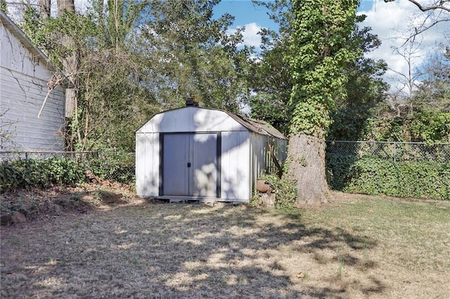 view of shed with a fenced backyard