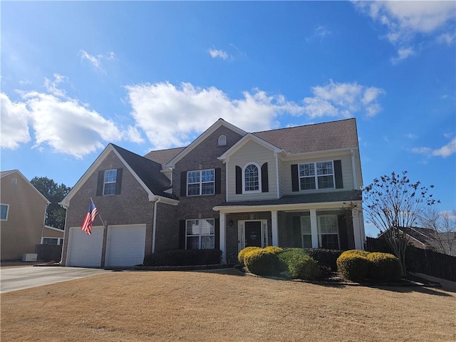 view of front of house featuring a garage and a front yard