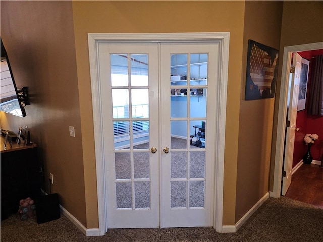 entryway with french doors and carpet flooring