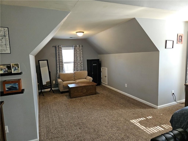 living room featuring lofted ceiling and carpet flooring