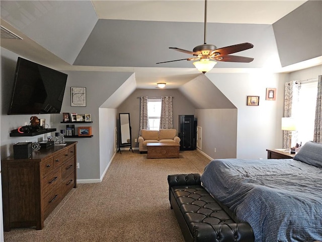 carpeted bedroom with vaulted ceiling and ceiling fan