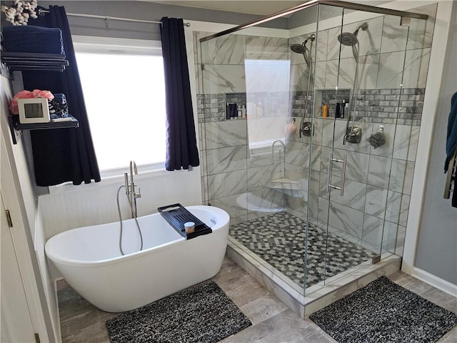 bathroom featuring shower with separate bathtub