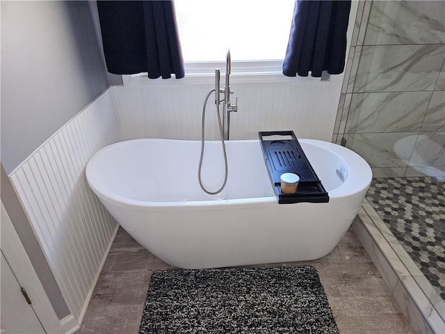 bathroom with a tub