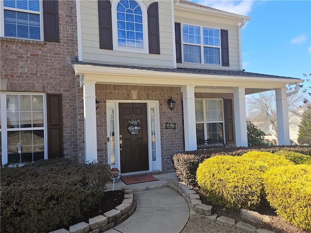 property entrance featuring a porch