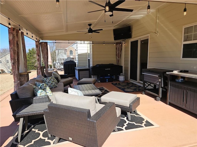 view of patio with outdoor lounge area and ceiling fan