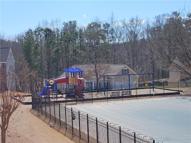 view of swimming pool featuring a playground