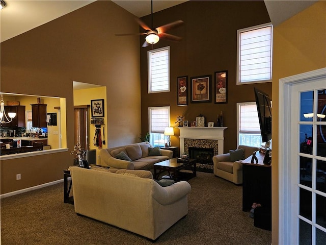 living room featuring ceiling fan, high vaulted ceiling, and dark carpet