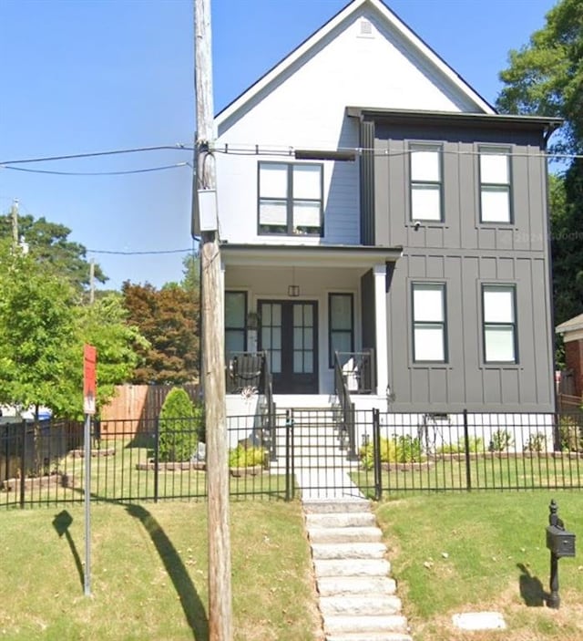 view of front facade featuring a porch and a front yard