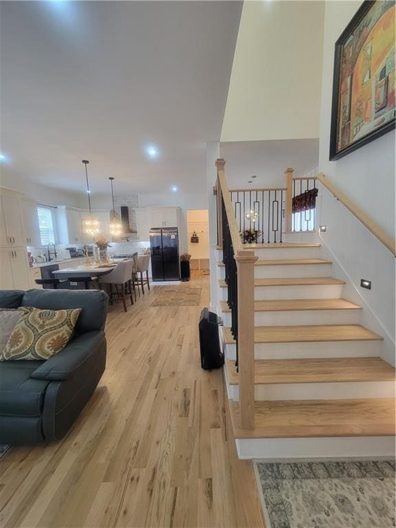 staircase with wood-type flooring