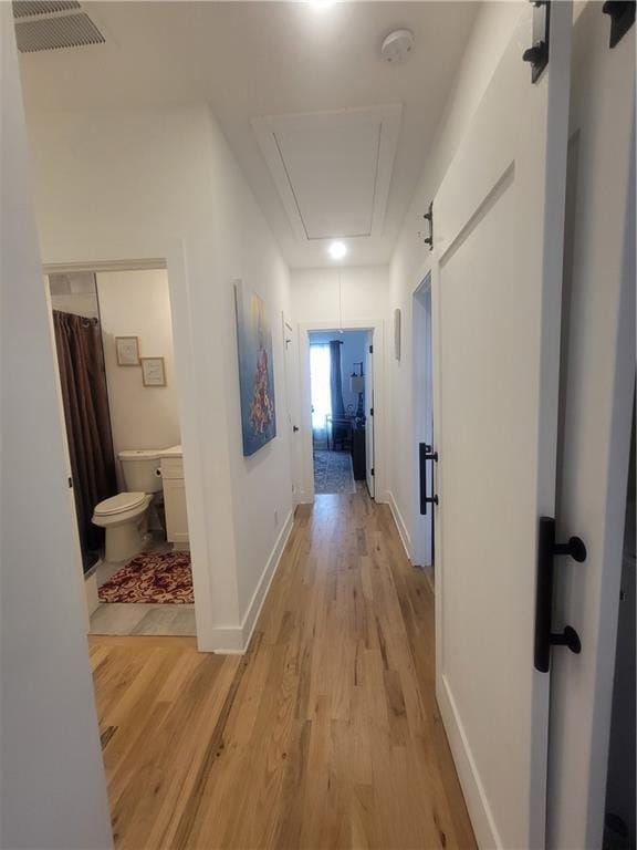 corridor featuring light hardwood / wood-style flooring