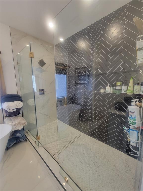 bathroom featuring walk in shower