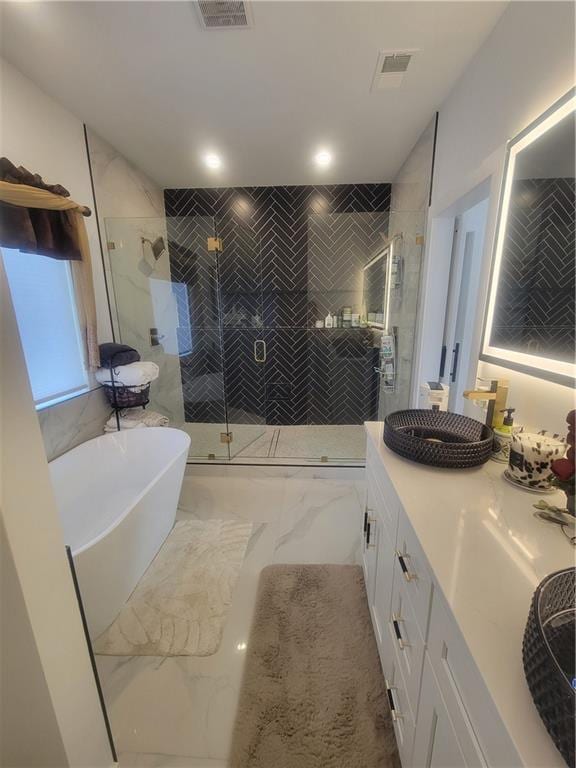 bathroom featuring vanity and plus walk in shower