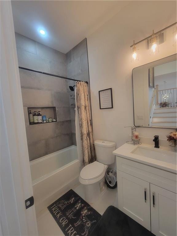 full bathroom with tile patterned flooring, shower / tub combo, vanity, and toilet