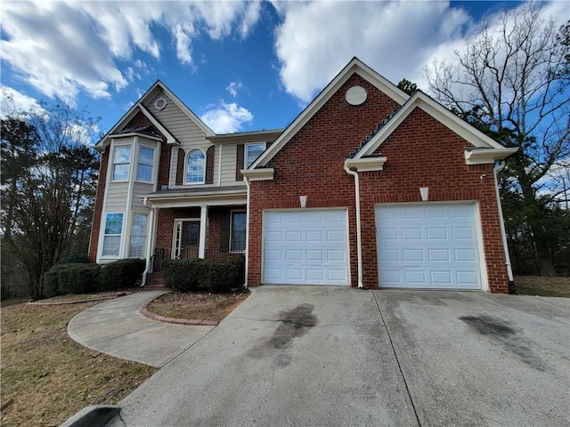 view of front of home with driveway, brick siding, and a garage