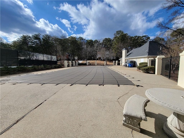 view of pool featuring fence and a patio area