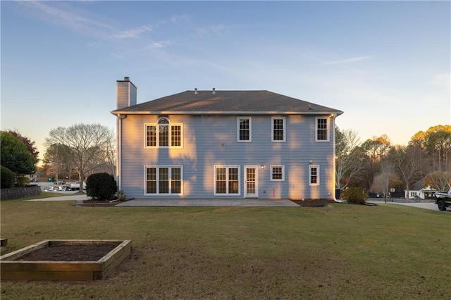 4120 Lakeside Blvd, Monroe, GA 30655 - back of house with a chimney and a yard
