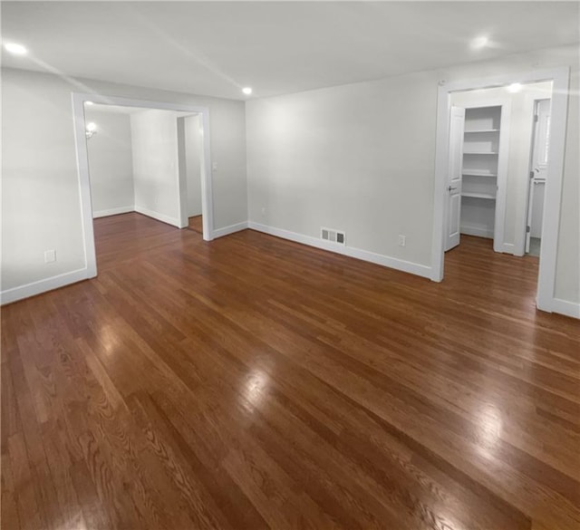 empty room featuring dark hardwood / wood-style flooring