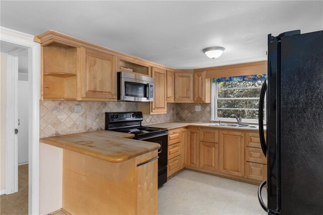 laundry area featuring stacked washer and clothes dryer, laundry area, and a sink