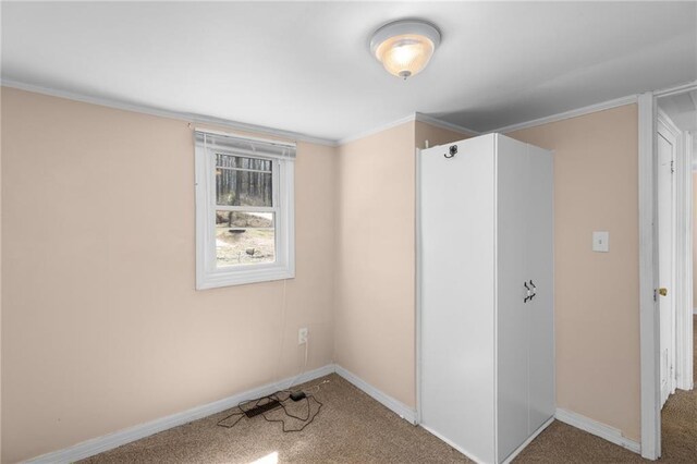 bathroom with a shower stall, toilet, and ornamental molding